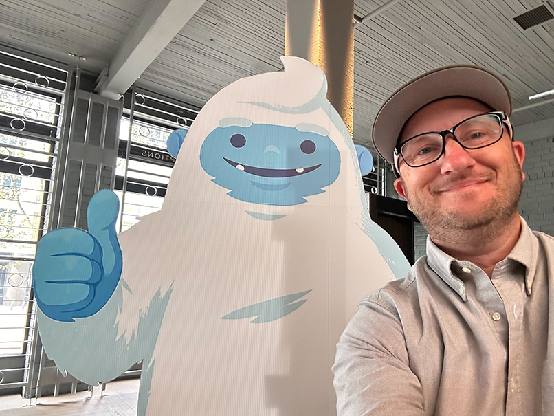 Ryan posing with a life-size Yedric cutout